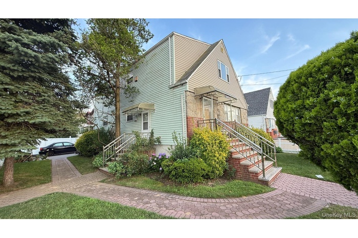 View of property exterior with a yard