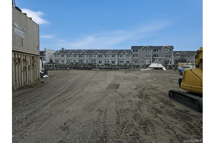 Uncovered parking lot with a residential view
