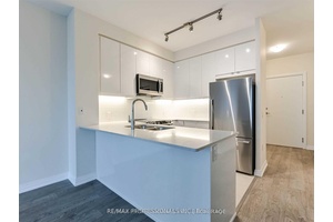 Welcome to this bright and modern 1 Den corner unit at Cypress at Pinnacle, offering stylish urban living with exceptional convenience.