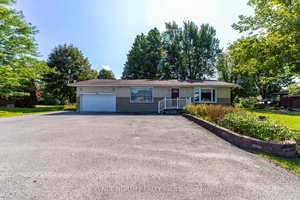 Welcome to this spacious and versatile detached bungalow with a two car garage, situated on a large lot with a generous rear yard.