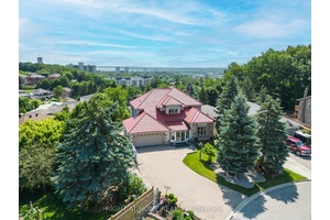 Original owner of this stunning custom built 2 Storey detached home, with a walkout basement, featuring 6 bedrooms, 6 bathrooms with 4 en suites.