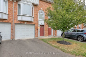 Stylish 3 bedroom townhome with a garage and green space !