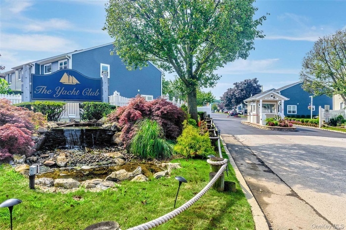Community sign featuring a garden pond