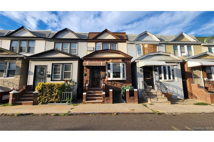View of front of property featuring brick siding