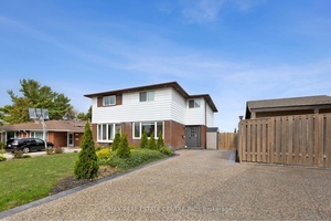 Welcome to 122 Mooregate Crescent, a fully renovated 4 1 bedroom semi detached home with a walk out basement.