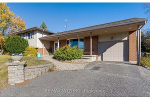 Detached home on a very private amp ; serene 1 acre lot.