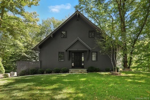 On the serene shores of Lake Truesdale in South Salem sits Blackbird Cottage, an utterly charming two bedroom that truly lives like a three.