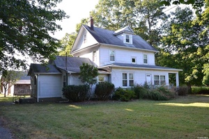 Endless possibilities. This property is a charming blend of rural tranquility and classic architecture, offering a unique opportunity for those seeking a spacious and versatile estate.