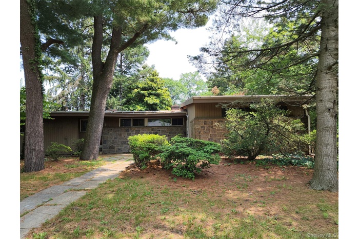 View of front of home featuring stone siding