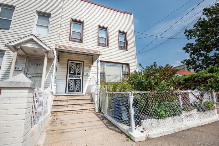 View of front of house featuring a fenced front yard