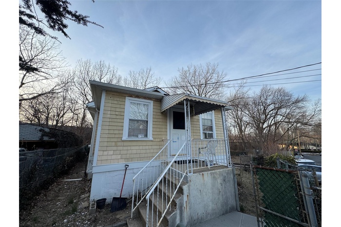 View of front of property with fence
