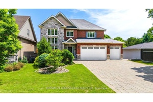 This custom built 2 storey home is set on a deep lot on the desirable Tooley Rd.