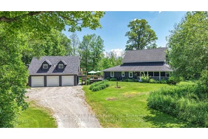 This extraordinary Century home is set on over 18 acres of peaceful, natural landscape.