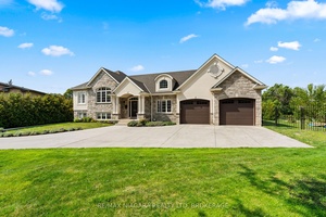 Custom built in 2016, this 5 bedroom, 4 bathroom home sits on an oversized mature lot in a sought after crescent and offers tall ceilings on every floor.