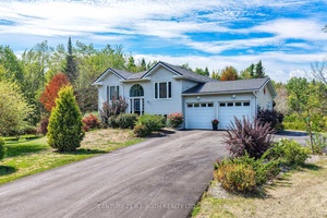 Set on 5 private acres with most of the property blanked with mature trees, this quiet retreat is minutes to Washago's shops, dining, and Hwy access.