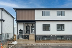 Charming End Unit Stacked Townhome in Niagara Falls Welcome to 435 4263 Fourth Avenue, a stunning end unit, top floor stacked townhome nestled in the heart of Niagara Falls, Ontario.