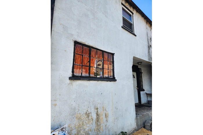 View of home's exterior with stucco siding