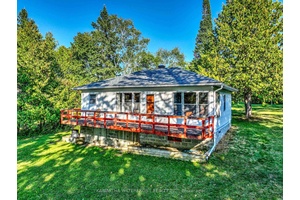 This cottage property is located in a peaceful and quiet location near the end of Redcap Beach Lane on Canal Lake.