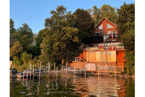 One of a kind chalet style waterfront home on Lake Scugog !