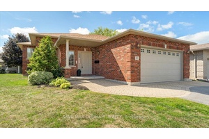 Legal 2 unit raised bungalow featuring a 3 bed, 2 bath upper unit with updated kitchen, main floor laundry amp ; walkout to private backyard.