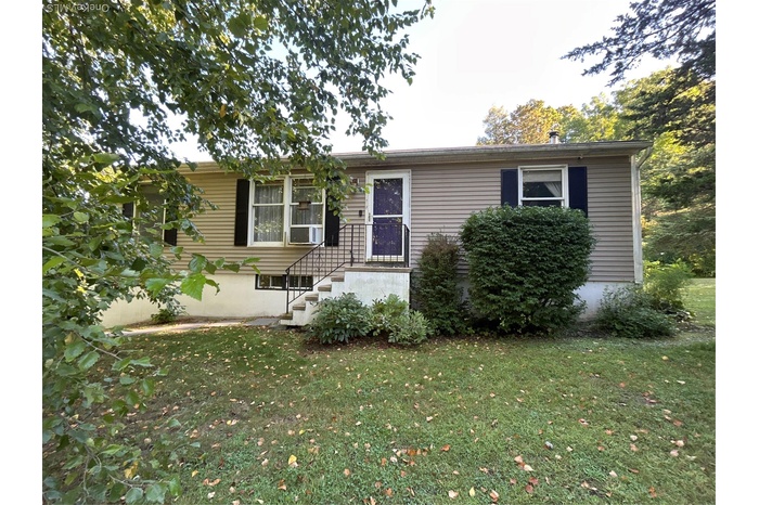 View of front of home featuring a front lawn