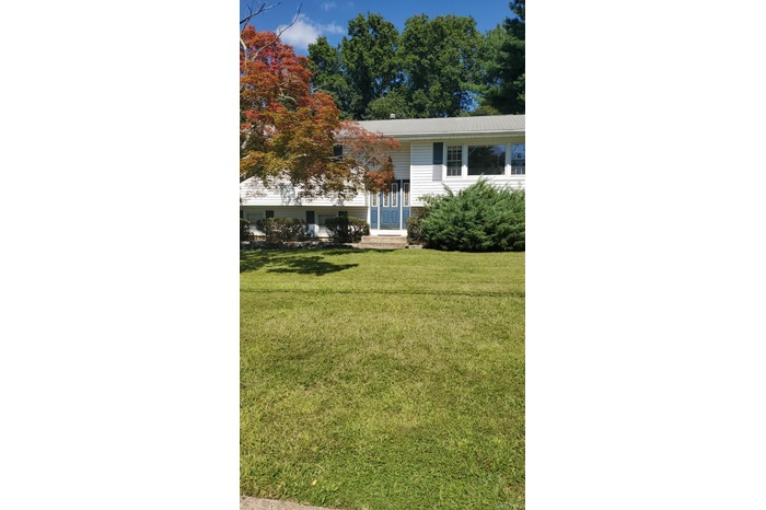 View of front of property with a front yard