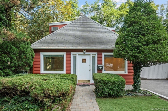 Bungalow-style house with a shingled roof