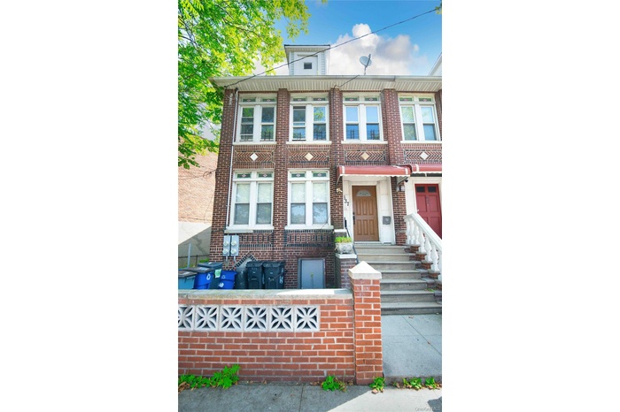 View of front of house featuring brick siding