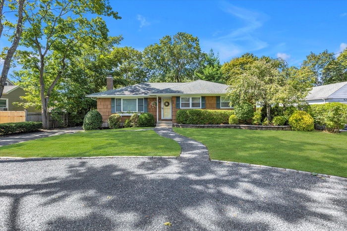 Single story home with a chimney and a shingled roof