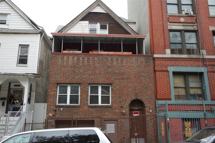 View of property featuring a fenced front yard
