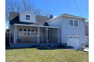 Welcome to this beautifully maintained split level home nestled on a quiet, tree lined street in Island Park.