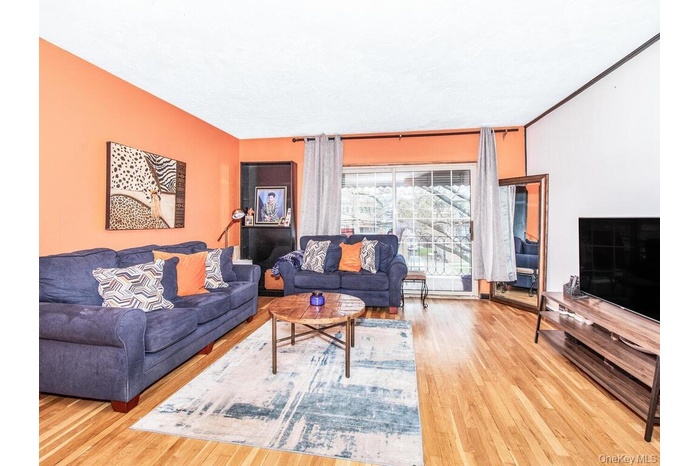 Living room featuring light wood-style flooring
