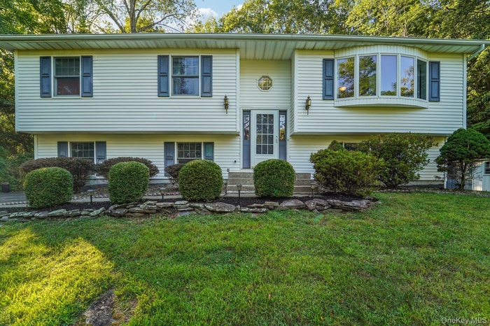 Bi-level home with landscaping