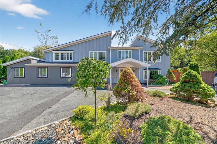 View of front of property featuring driveway
