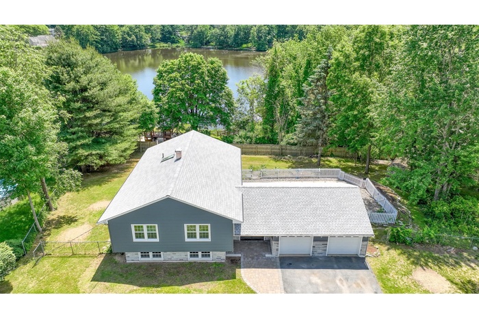 View from above of property with a large body of water