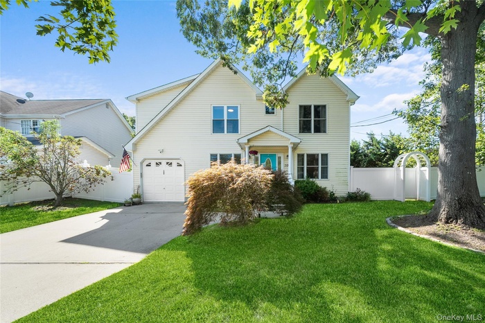Traditional-style home with driveway and a garage