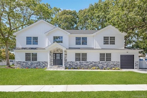 Nestled on an oversized 100x105 lot in the highly sought after Village of Massapequa Park, this beautiful 5 bedroom, 3 bath home blends timeless craftsmanship with modern comforts.