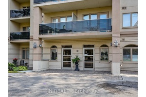 Step into this bright and spacious 1259 sq ft, ground level, corner unit condo offering the perfect blend of comfort and convenience.