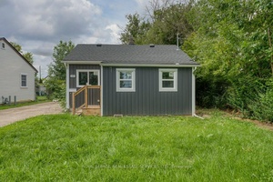 Nestled on a spacious corner lot, this charming Duplex bungalow showcases numerous updates throughout.