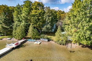 Picturesque four season cottage or home nestled into a beautiful bay on pristine Skeleton Lake.