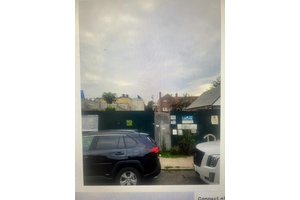 10, 600 SQ. FT. OF VACANT LAND ZONED COMMERCIAL WITH APPROVED PLANS