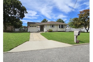 Welcome to 12 Choate Ave in Selden which features a large Eat in Kitchen with a skylight that includes updated cabinets and recess lighting.