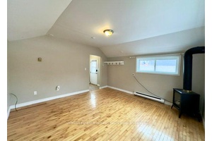 2 bedroom, 1 bathroom, 1 assigned parking space in back lot.