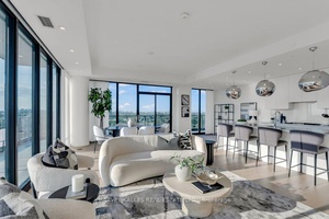 Welcome to an extraordinary 2 1 bedroom, 3 bathroom corner suite in the prestigious Upper East Village community.