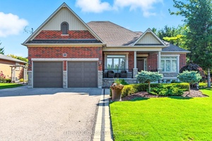 Exquisite custom built bungalow featuring over 4400 sqft of finished living space blending comfort, thoughtful design and unmatched quality.