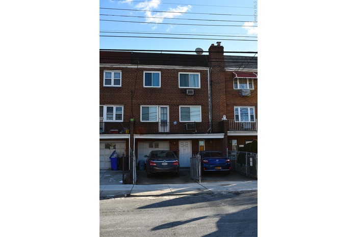 View of front of home featuring brick siding