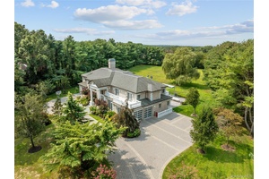 This gorgeous Brick Colonial, located in Upper Brookville, is a beautiful and elegant estate that sits on 2.