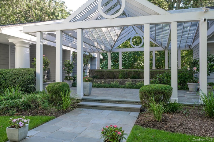 Courtyard Entrance to Spectacular Pergola w Colorful Gardens