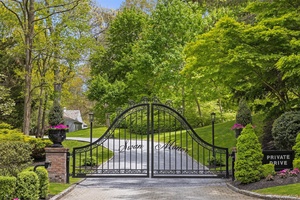 Set on 9 pristine acres with panoramic views of Long Island Sound, this private, gated estate is a masterpiece of history and modern refinement.