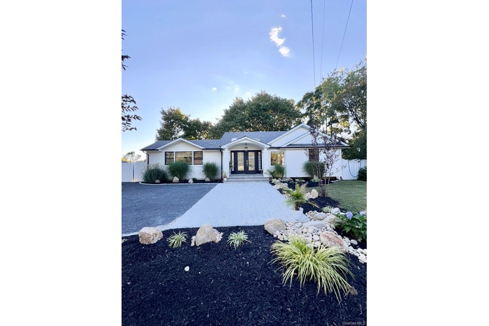 Split-ranch style house with french doors